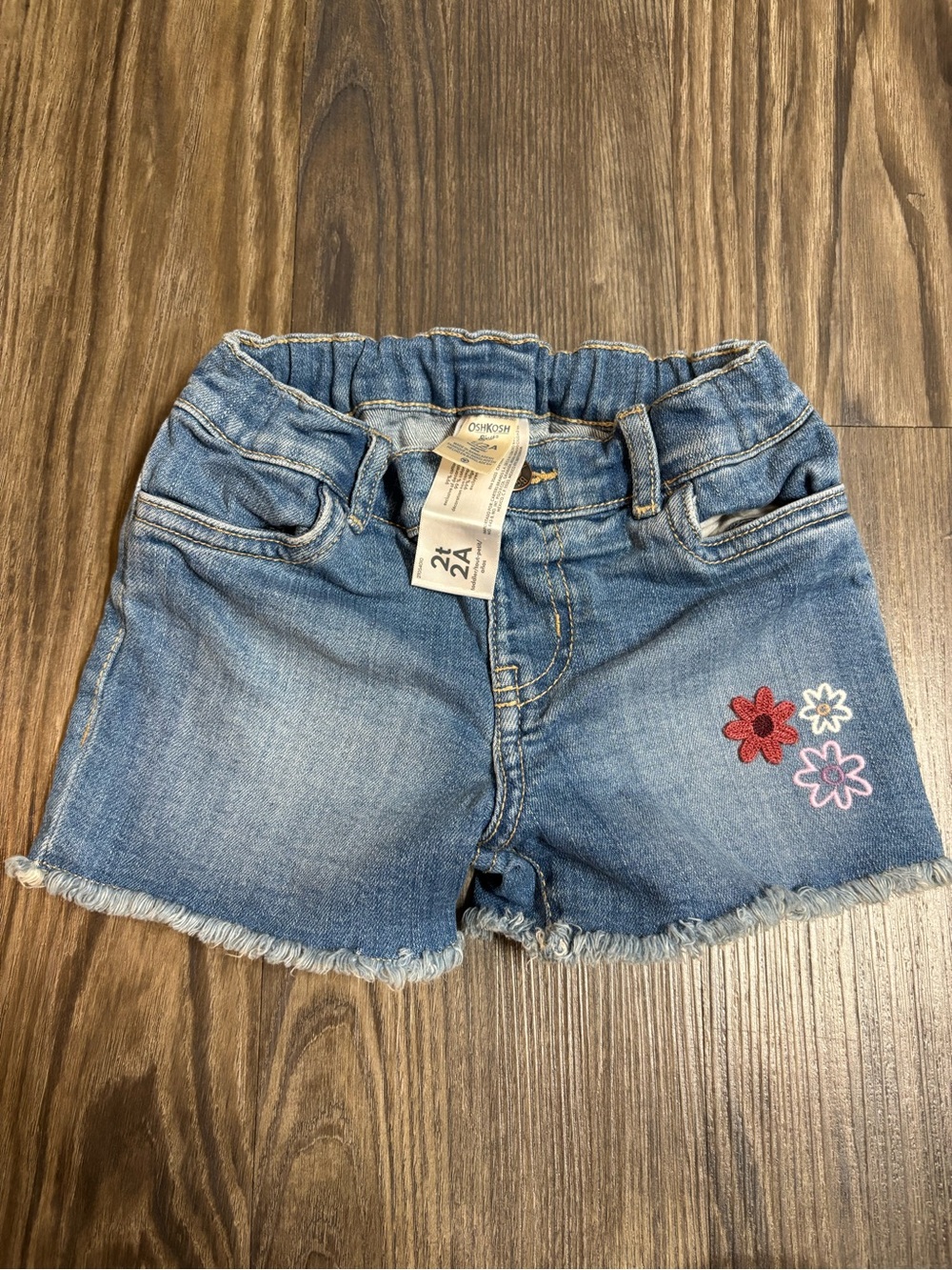 OshKosh B'gosh girl toddler Light Blue Denim Shorts with Flower Patch